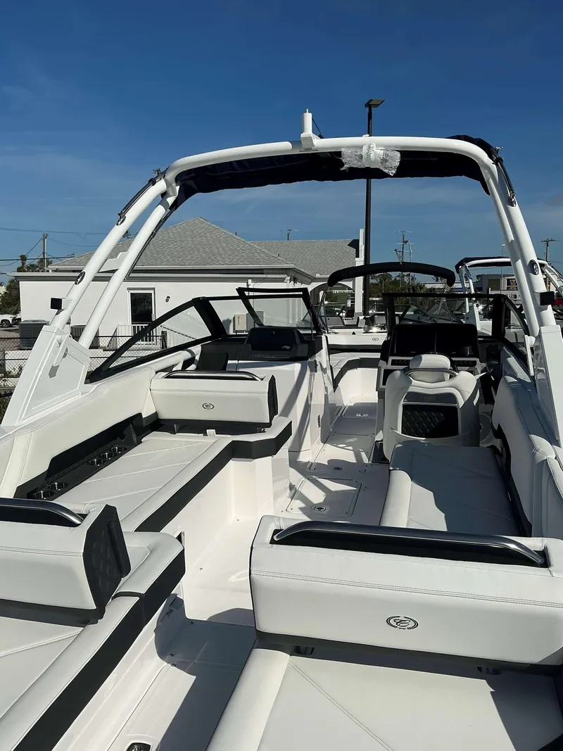 Slide: The Image of 2025 Cobalt R8 boat interior with white seating and sleek design. - 4