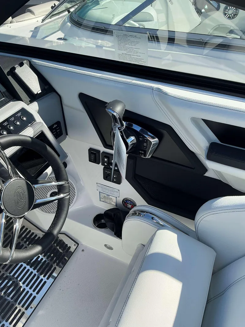 Slide: The Image of Interior of 2025 Cobalt R8 boat with sleek controls and steering wheel. - 5