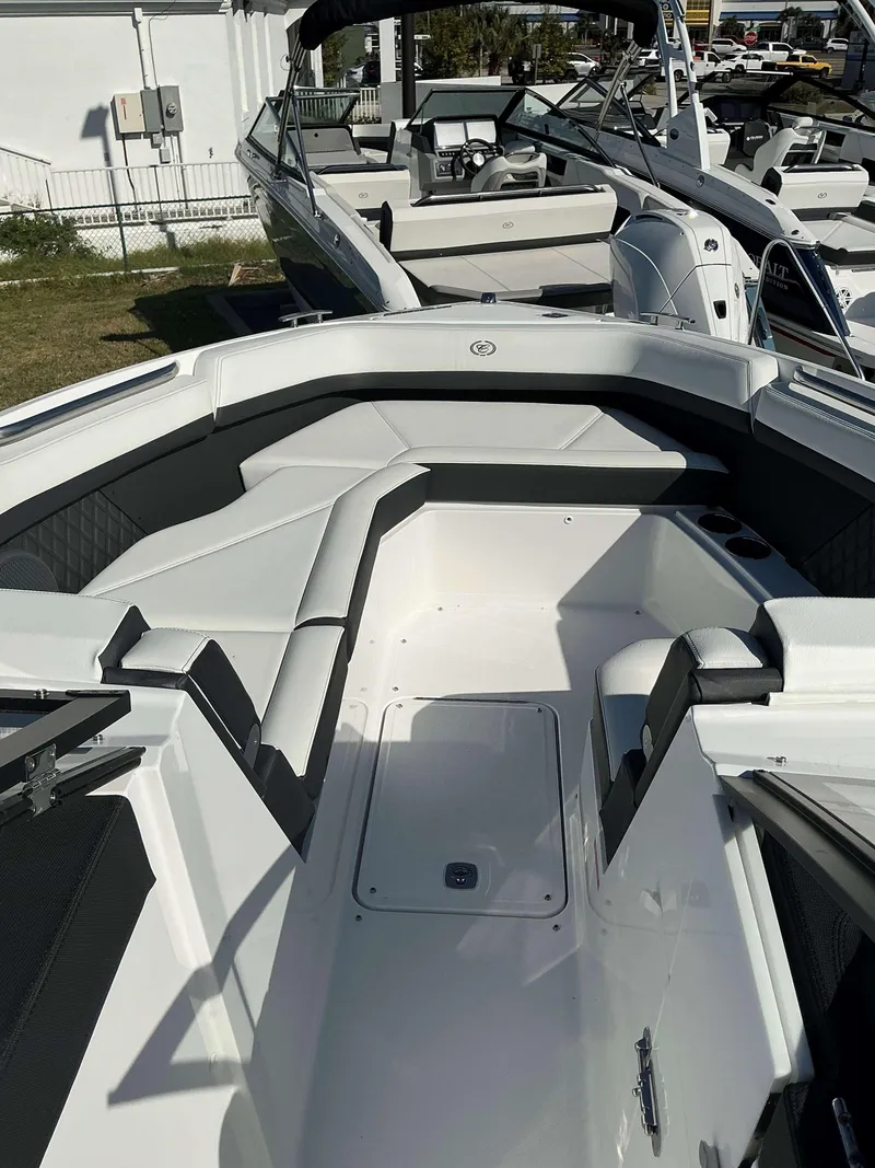 Slide: The Image of 2025 Cobalt R8 boat interior with sleek white seating and modern design. - 8