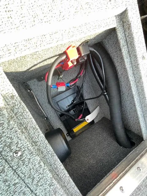 Slide: The Image of 2025 Lund 1650 Rebel XL SS boat compartment with wiring and components. - 14