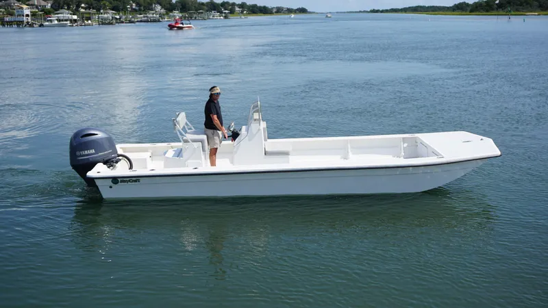 Slide: The Image of 2023 May-Craft 25 Hancock Skiff on calm water, side view. - 3
