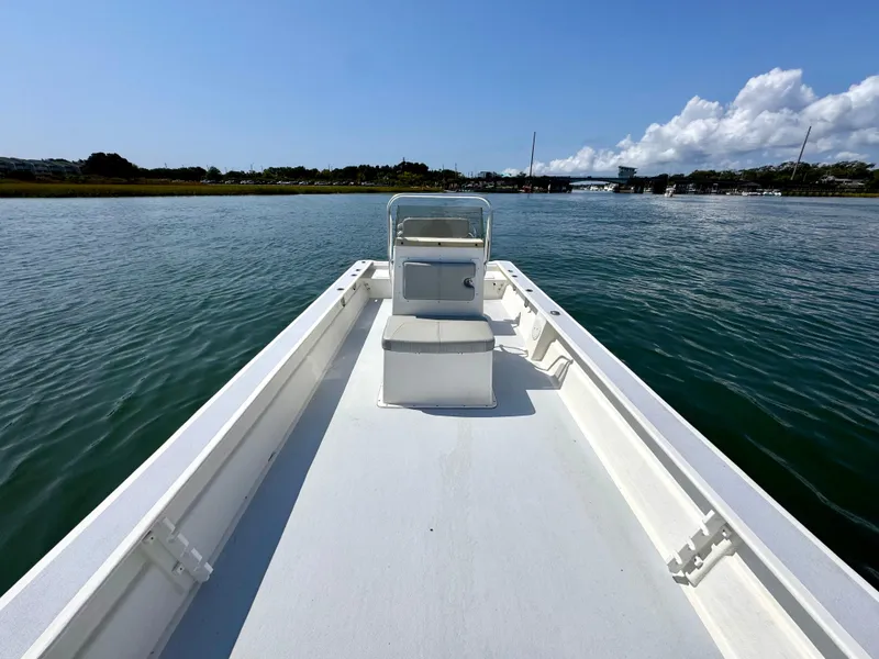 Slide: The Image of 2023 May-Craft 25 Hancock Skiff on calm water, clear sky background. - 7