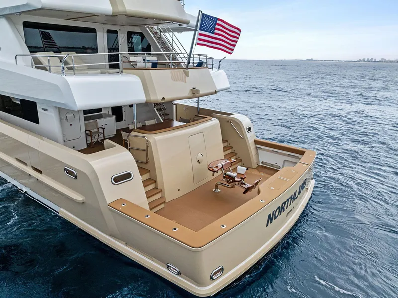 Slide: The Image of Luxurious 2017 Burger 104 Motor Yacht on open sea with American flag. - 10