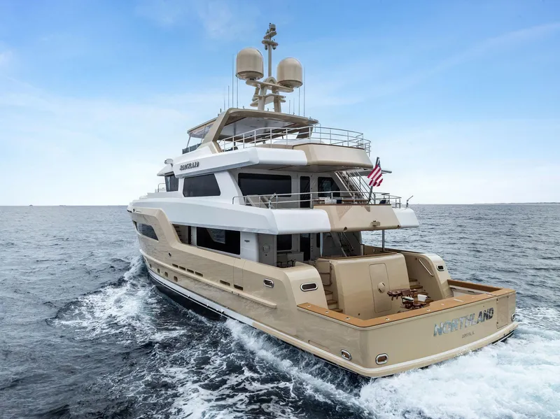 Slide: The Image of Luxurious 2017 Burger 104 Motor Yacht cruising on open sea, rear view. - 12