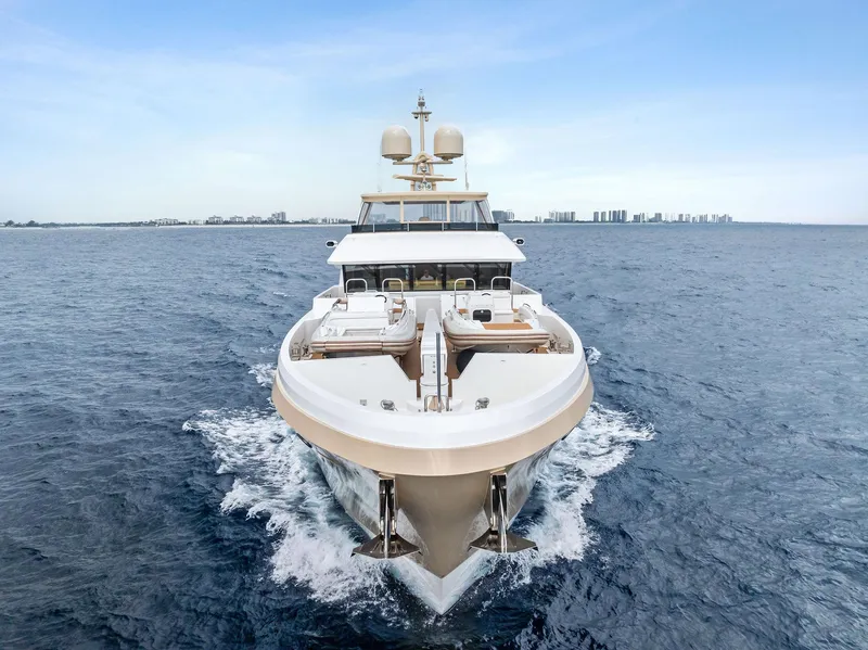 Slide: The Image of 2017 Burger 104 Motor Yacht cruising on open sea, front view. - 13