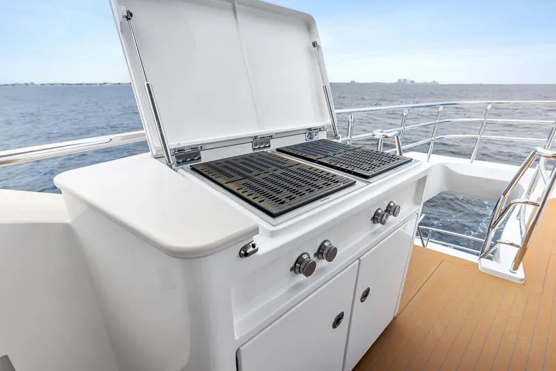 Slide: The Image of Outdoor grill on 2017 Burger 104 Motor Yacht deck, overlooking ocean. - 27