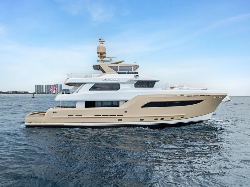 Slide: The Image of Luxurious 2017 Burger 104 Motor Yacht cruising on open water. - 3