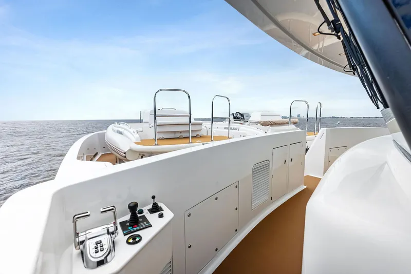 Slide: The Image of 2017 Burger 104 Motor Yacht deck with ocean view, featuring sleek design and modern controls. - 31