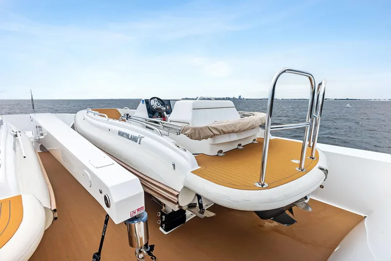 Slide: The Image of 2017 Burger 104 Motor Yacht with tender on deck, ocean view. - 32