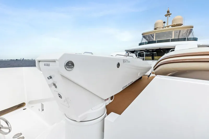 Slide: The Image of 2017 Burger 104 Motor Yacht deck with crane and seating area. - 36