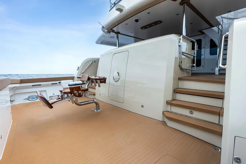 Slide: The Image of Luxurious 2017 Burger 104 Motor Yacht deck with elegant wood finish and modern design. - 38