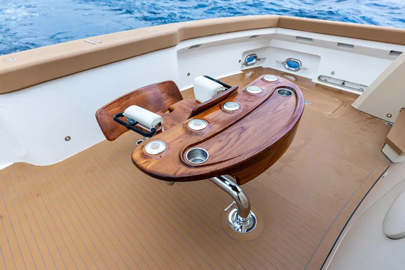 Slide: The Image of Luxurious 2017 Burger 104 Motor Yacht deck with elegant wooden table and ocean view. - 40