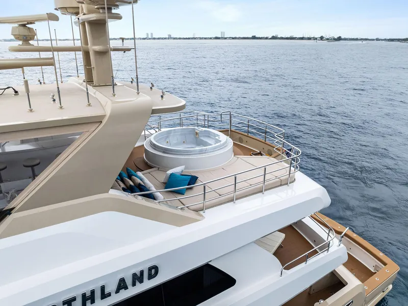 Slide: The Image of Luxury 2017 Burger 104 Motor Yacht with jacuzzi on deck, cruising on open water. - 6