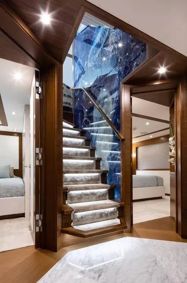 Slide: The Image of Luxurious interior of 2017 Burger 104 Motor Yacht with elegant staircase and modern design. - 72