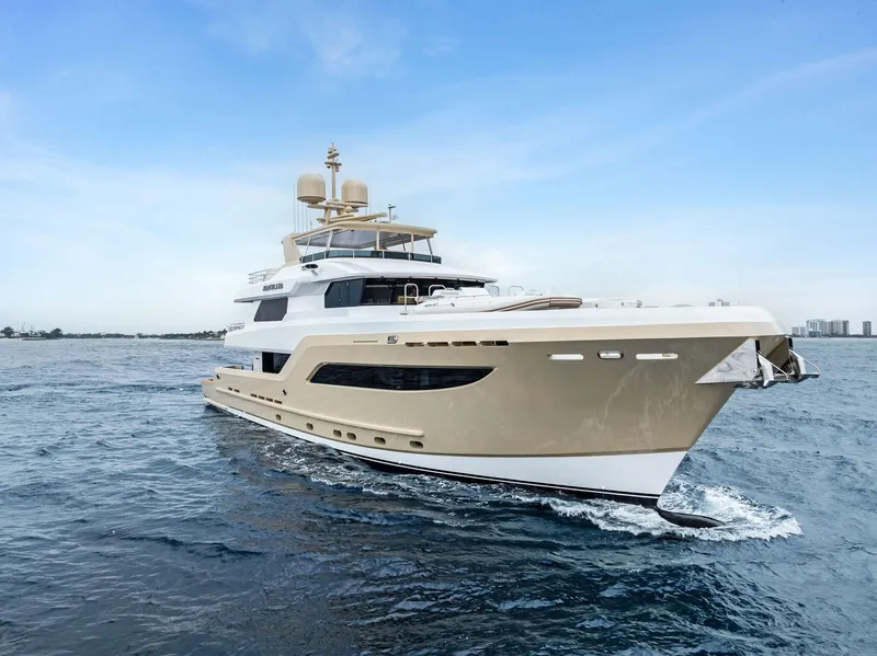 Slide: The Image of Luxurious 2017 Burger 104 Motor Yacht cruising on open water. - 8