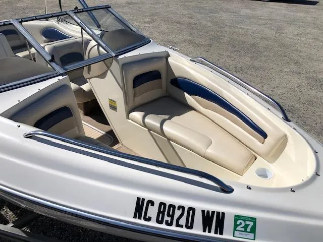 Slide: The Image of 2001 Stingray 180 LS/LX boat with beige seating and blue accents, registration NC 8920 WN. - 10
