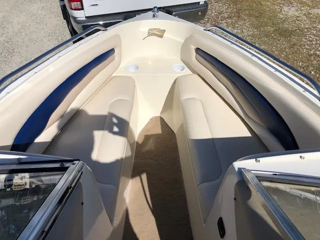 Slide: The Image of 2001 Stingray 180 LS/LX boat interior with beige and blue seating. - 12