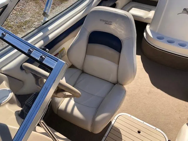 Slide: The Image of 2001 Stingray 180 LS/LX boat interior with beige seating and steering wheel. - 15