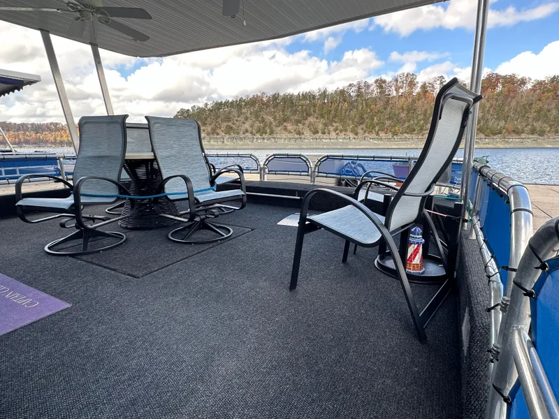 Slide: The Image of Outdoor seating on 2001 Sharpe 16x80 houseboat deck, overlooking scenic lake and forest. - 10