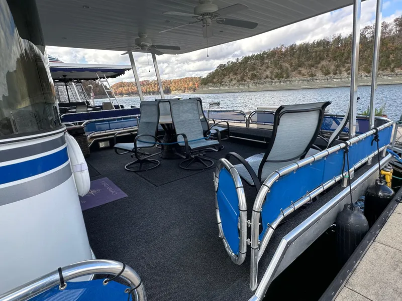 Slide: The Image of Spacious deck of 2001 Sharpe 16x80 houseboat with lake view and seating. - 11