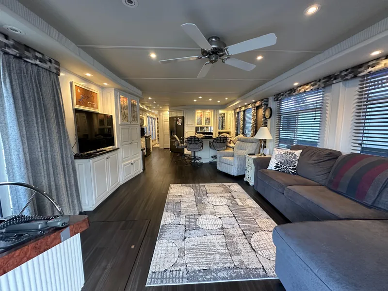 Slide: The Image of Luxurious 2001 Sharpe 16x80 houseboat interior with modern furnishings and elegant decor. - 12