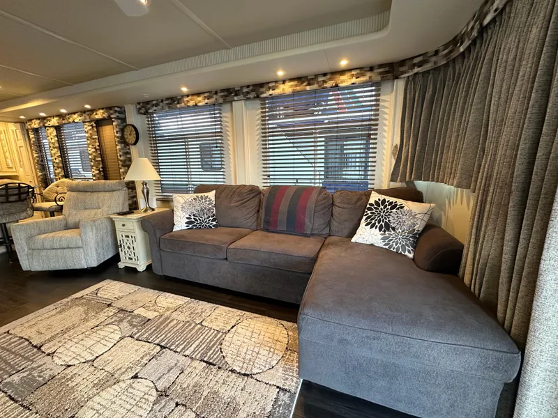 Slide: The Image of Cozy living area in 2001 Sharpe 16x80 houseboat with modern furnishings and decor. - 13