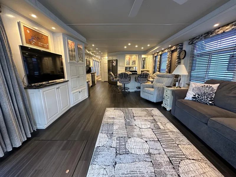 Slide: The Image of Luxurious 2001 Sharpe 16x80 houseboat interior with modern decor and spacious living area. - 15