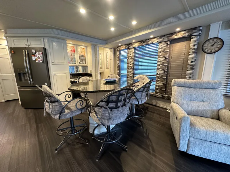 Slide: The Image of Modern kitchen and dining area in 2001 Sharpe 16x80 houseboat with stylish decor. - 17