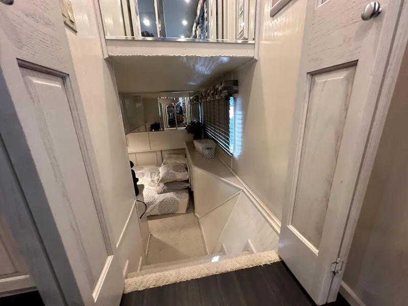 Slide: The Image of Interior of 2001 Sharpe 16x80 houseboat with cozy seating area and modern decor. - 23