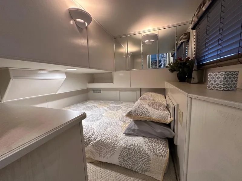 Slide: The Image of Cozy bedroom in 2001 Sharpe 16x80 houseboat with modern decor and soft lighting. - 24