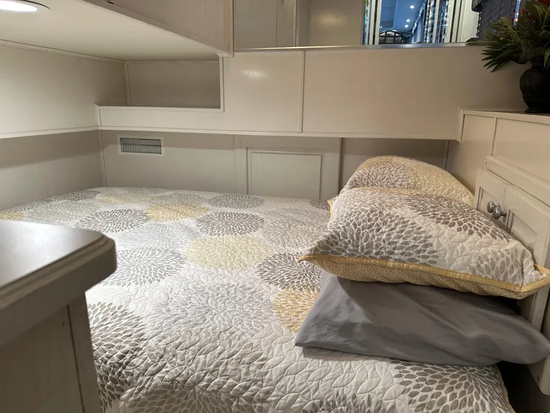 Slide: The Image of Cozy bedroom in 2001 Sharpe 16x80 houseboat with patterned bedding and soft lighting. - 25