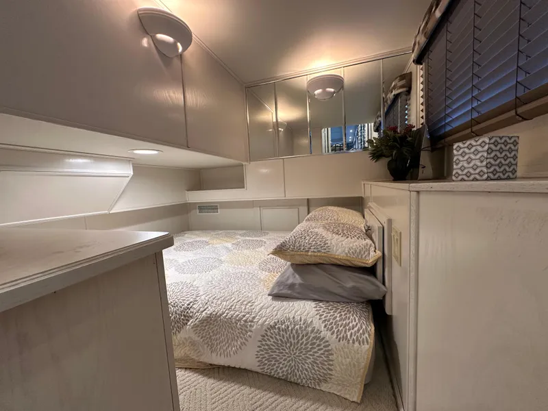 Slide: The Image of Cozy bedroom in 2001 Sharpe 16x80 houseboat with modern decor and soft lighting. - 26