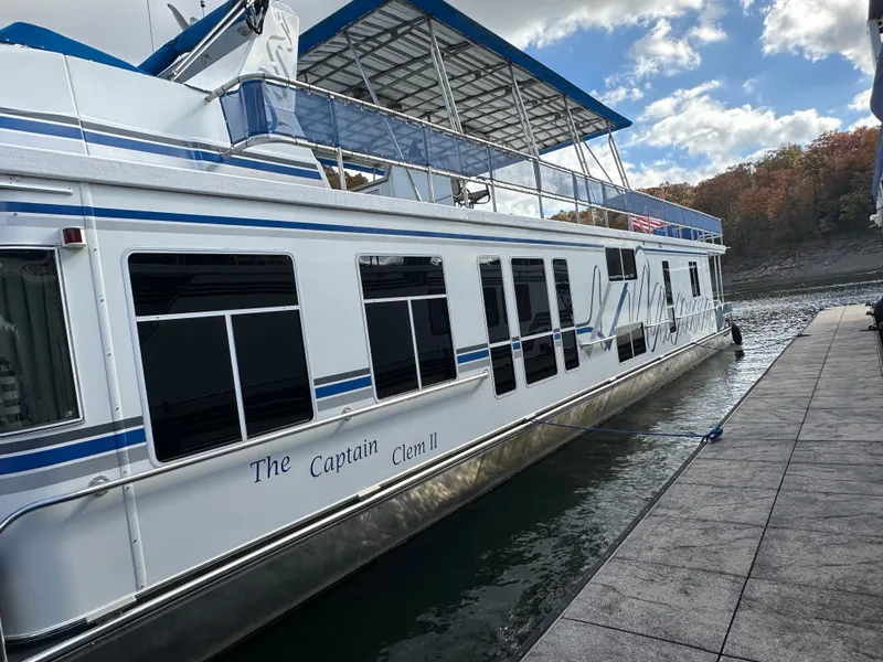 Slide: The Image of Houseboat "The Captain Clem II" docked, Sharpe 16x80 model, 2001, on a sunny day. - 3