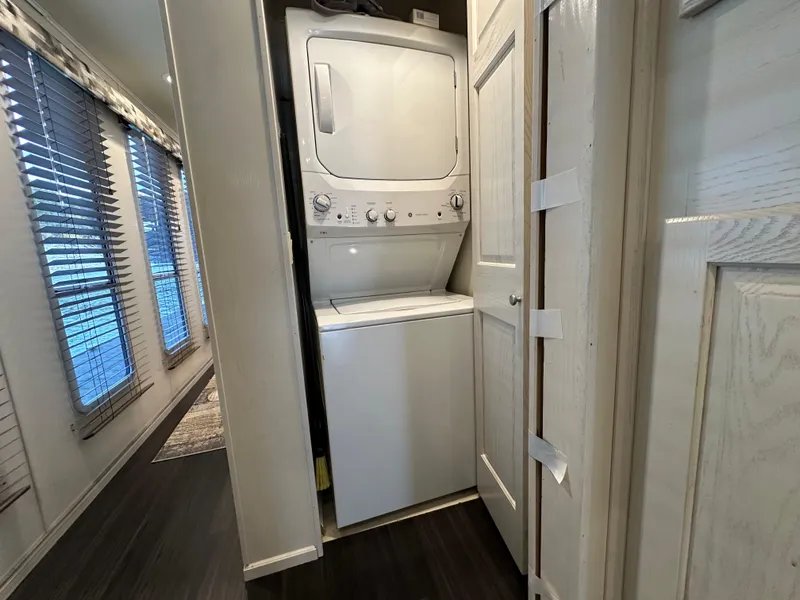 Slide: The Image of Stacked washer and dryer in 2001 Sharpe 16x80 houseboat interior. - 30