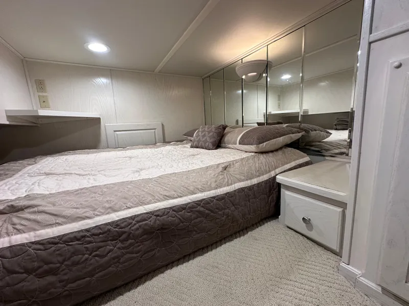 Slide: The Image of Cozy bedroom in 2001 Sharpe 16x80 houseboat with mirrored walls and soft lighting. - 40