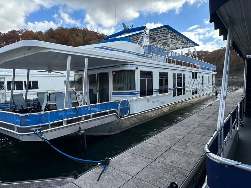 Slide: The Image of 2001 Sharpe 16x80 houseboat docked on a sunny day. - 6