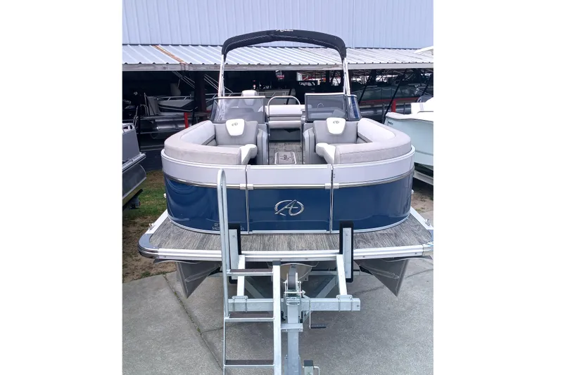 Slide: The Image of 2023 Avalon Catalina Elite Windshield pontoon boat with blue exterior and spacious seating. - 8
