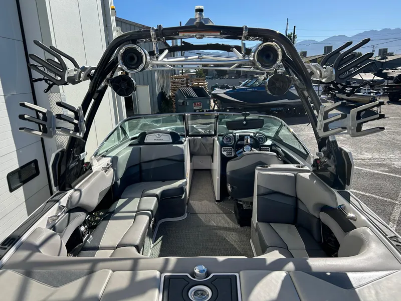 Slide: The Image of 2015 Supra SC400-550 boat interior with seating and wakeboard racks. - 5