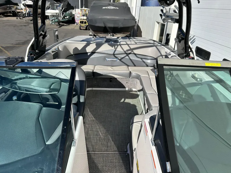 Slide: The Image of 2015 Supra SC400-550 boat interior with seating and open deck view. - 7