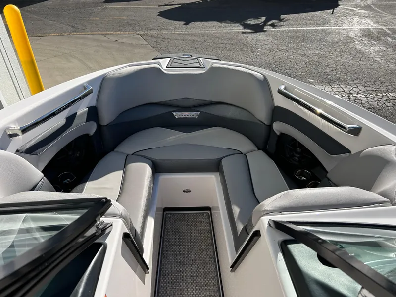 Slide: The Image of 2015 Supra SC400-550 boat interior with gray seating and sleek design. - 8