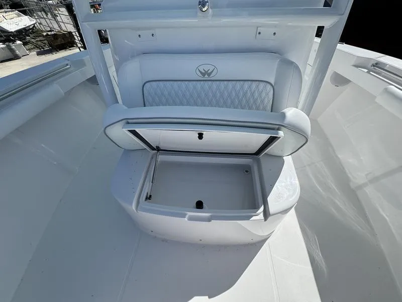 Slide: The Image of 2025 Southport 30 FE boat with open storage compartment on deck. - 14