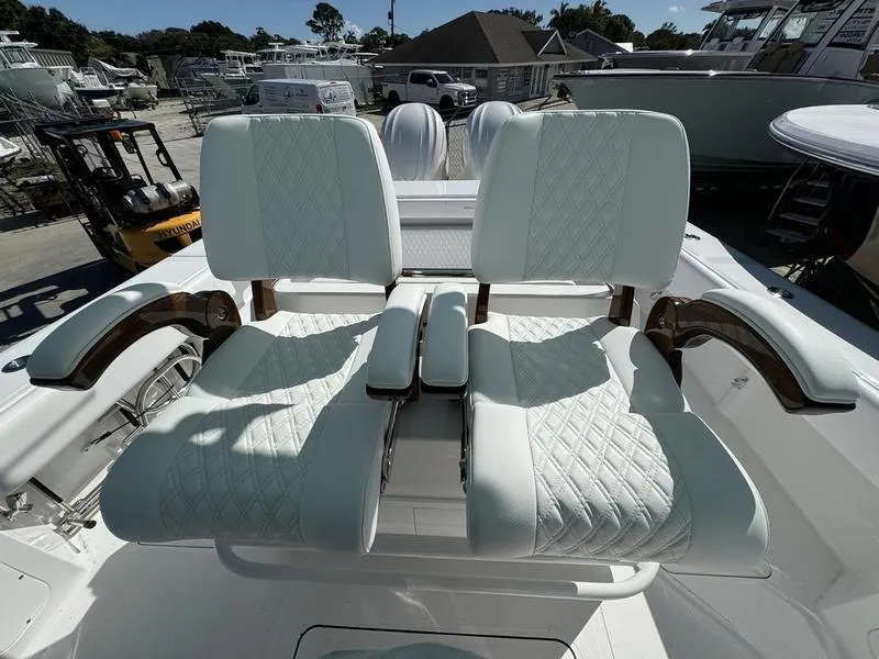 Slide: The Image of 2025 Southport 30 FE boat with luxurious white seating and armrests. - 25
