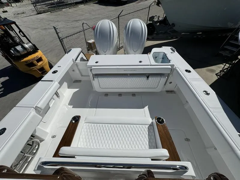 Slide: The Image of 2025 Southport 30 FE boat interior with seating and dual engines. - 31