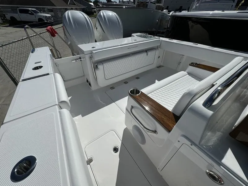 Slide: The Image of 2025 Southport 30 FE boat interior with seating and twin engines. - 32