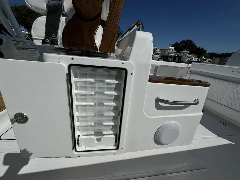 Slide: The Image of 2025 Southport 30 FE boat interior with storage compartments and seating. - 36