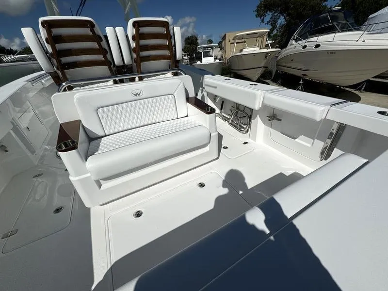 Slide: The Image of 2025 Southport 30 FE boat interior with white seating and modern design. - 38