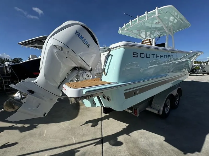 Slide: The Image of 2025 Southport 30 FE boat with Yamaha engine, parked on a trailer. - 5