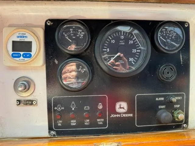 Slide: The Image of Control panel of a 1983 DeFever 41 Trawler with John Deere gauges. - 11