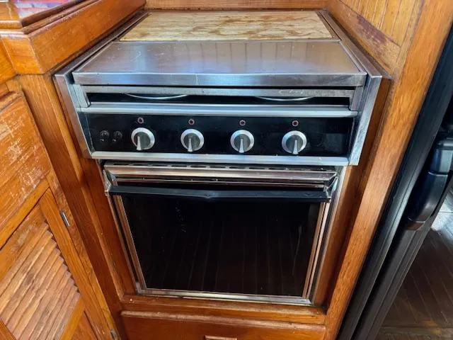 Slide: The Image of Vintage stove and oven in 1983 DeFever 41 Trawler kitchen. - 24