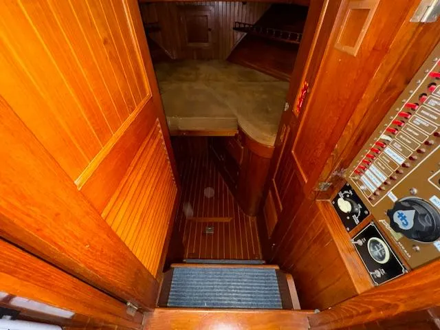 Slide: The Image of Interior view of 1983 DeFever 41 Trawler with wooden paneling and control panel. - 38